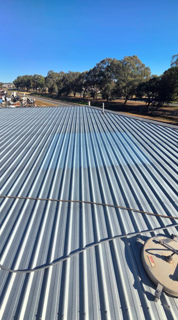 Commercial colorbond roof being surface cleaned