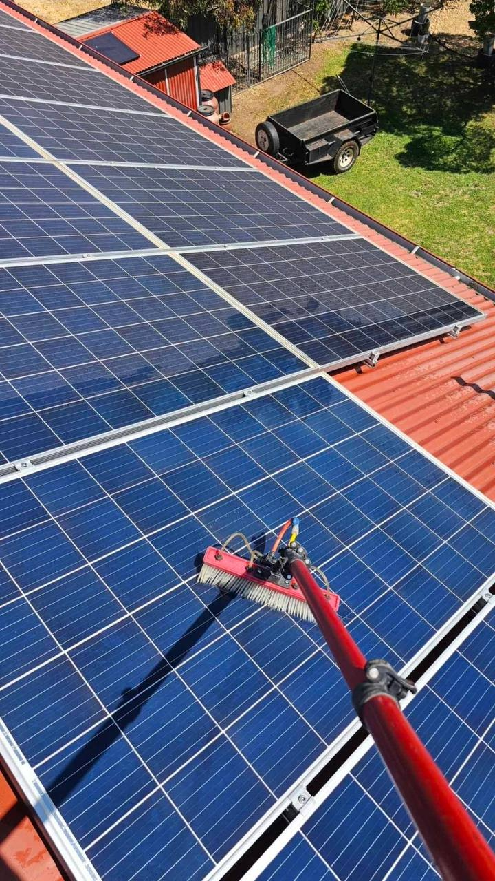 Pure water solar panel cleaning on a roof
