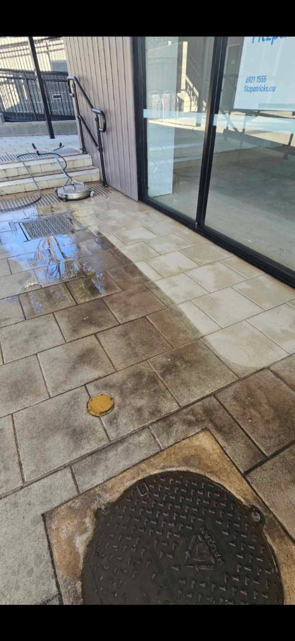 Large commercial walkway pressure cleaning in progress